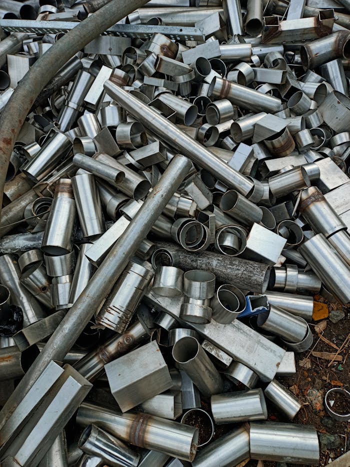 pexels-photo-12587565 A large heap of assorted metal pipes and tubes in Indore, showcasing industrial materials.